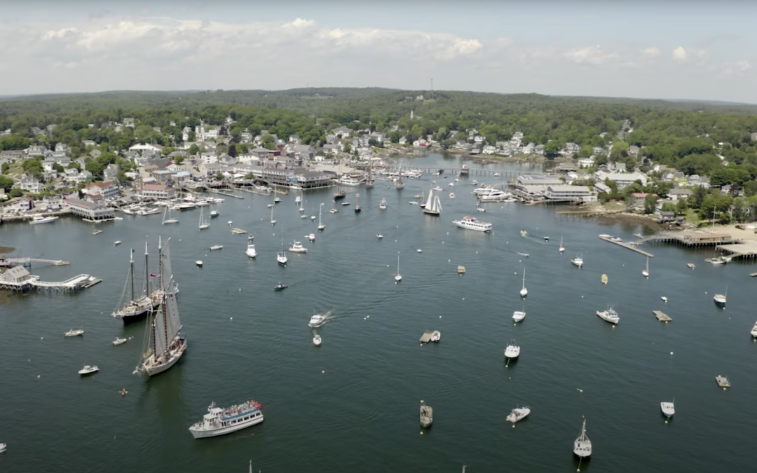 Arial shot of Boothbay harbor filled with ships of all different sizes