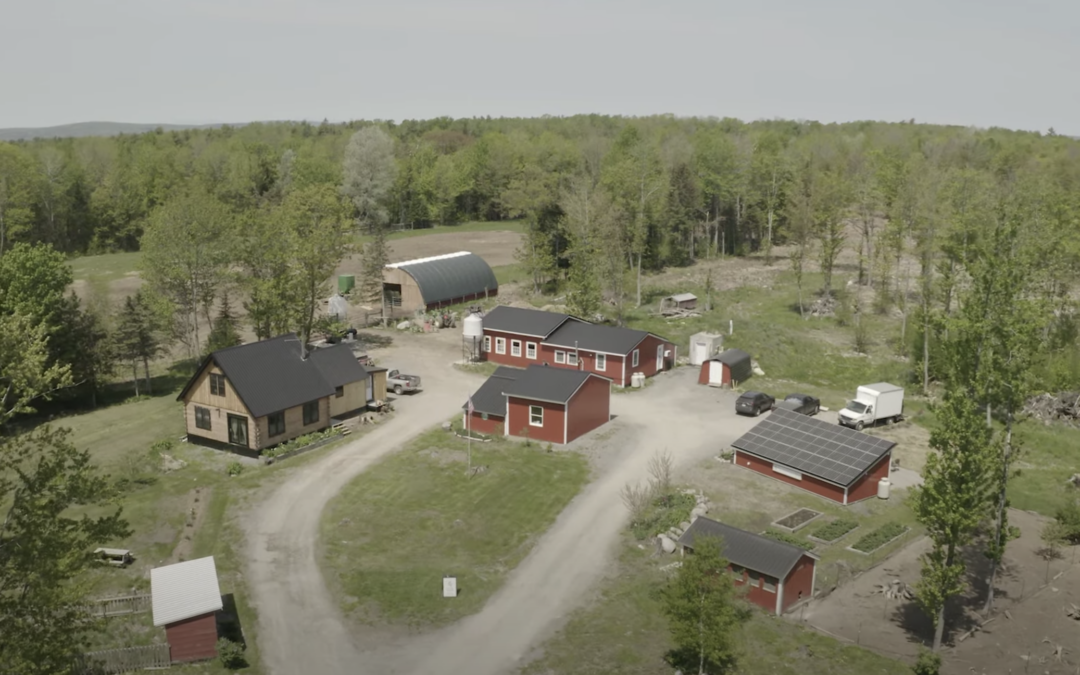 Airal view of a farm with a red barn